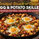 Breakfast brunch or dinner egg and potato skillet with crispy potatoes, sunny eggs, and cheese in cast iron pan
