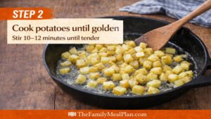 Cooking diced potatoes in skillet until golden for egg and potato skillet recipe step 2