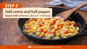 Adding onion and bell pepper to skillet with potatoes for egg and potato skillet recipe step 3