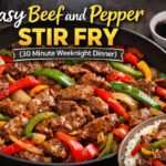 Easy beef and pepper stir fry in a skillet with bell peppers and savory sauce, served with rice